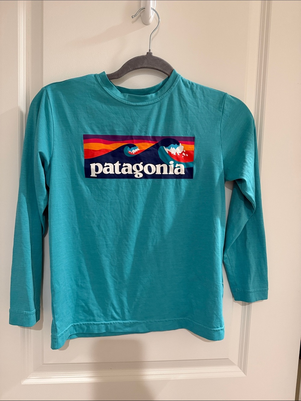 Patagonia Kids Teal Long-Sleeve Logo Tee with Multicolor Wave Graphic